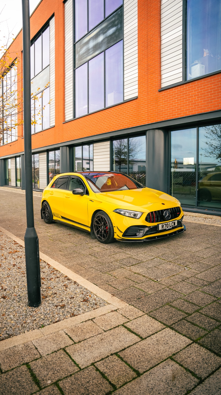 Yellow Mercedes-AMG A35 — front three-quarter